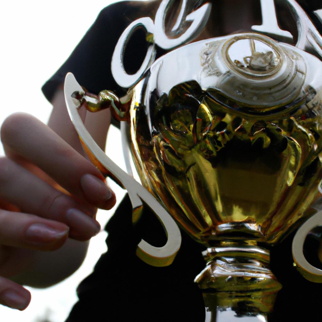 Person holding a winning trophy